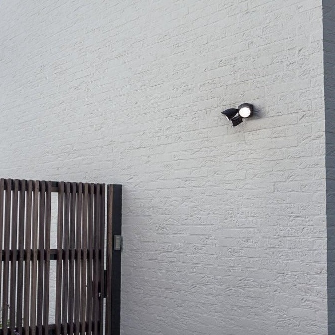 Lutec Shrimp PIR Outdoor LED Spotlight Wall Light - Black 7622222012 outside a garden gate