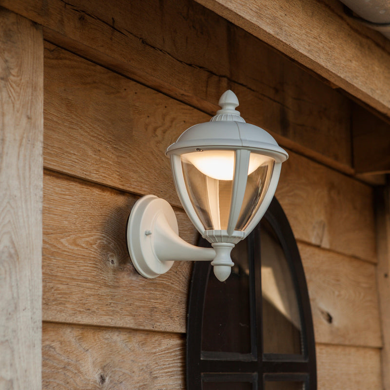 Lutec Unite Outdoor LED Wall Light In White 5260101030 attached to a shed