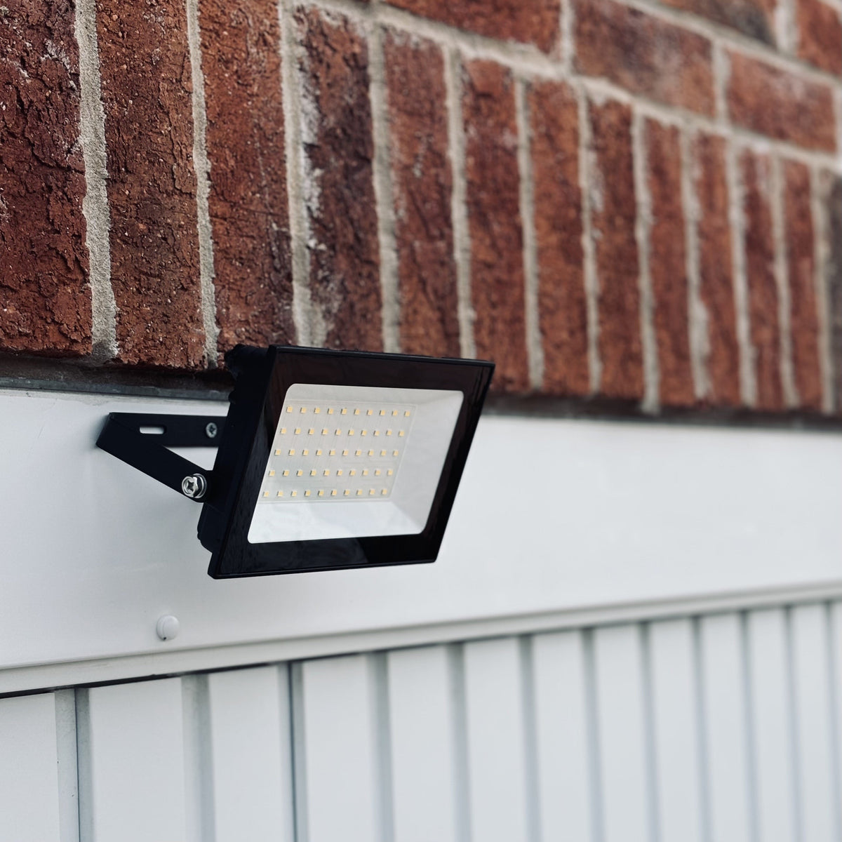 Lutec Halo 50W LED Outdoor Floodlight – Black (IP65) by Lutec — suits living rooms, bedrooms & hallways