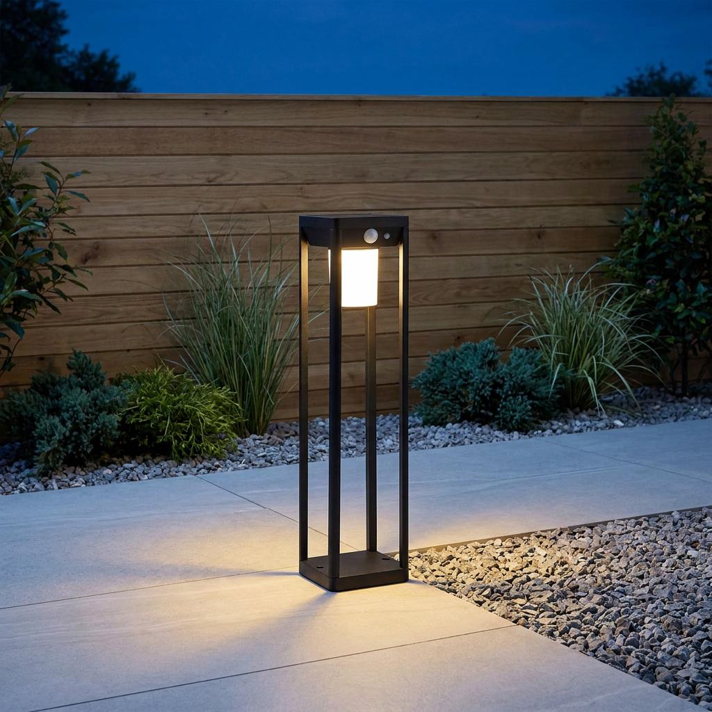 Black solar-powered outdoor post light with PIR sensor illuminating a garden patio path at dusk.
