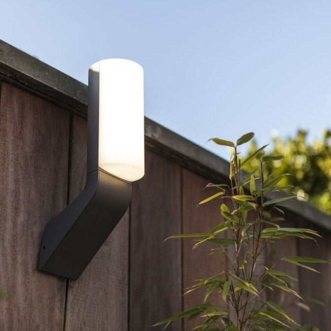 Lutec Bati Integrated LED Outside Wall Light - Grey 5188601125 attached to a fence