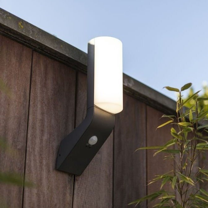 Lutec Bati Outdoor LED Wall Light With Motion Sensor 5188602125 attached to a fence
